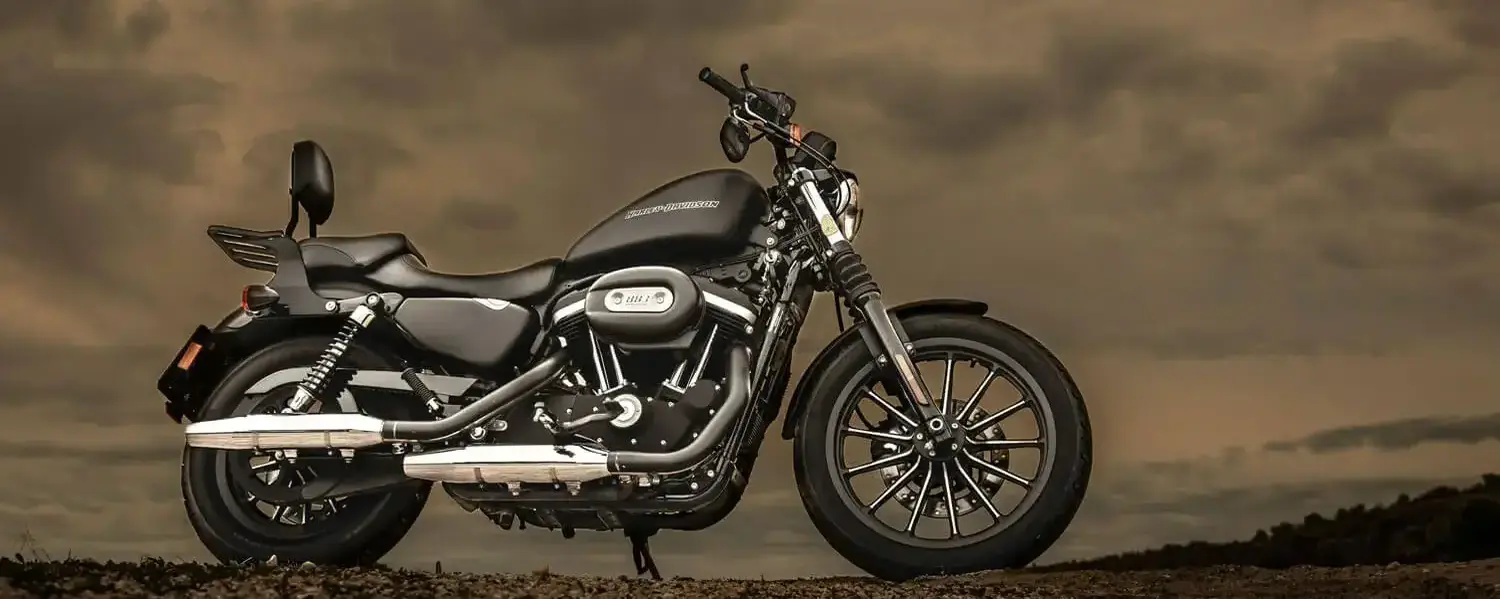A black Harley-Davidson Iron 883 Sportster