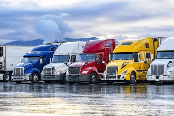 a row of parked semi trucks